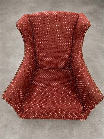 Red and Gold Patterned Upholstered Wingback Chair with Nailhead Trim