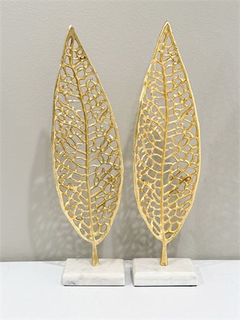 Metal Leaf Sculptures On Marble Stands