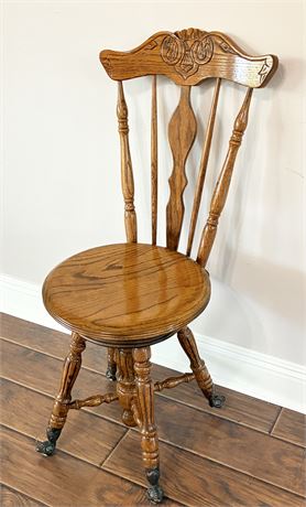 Vtg Solid Oak Piano/Organ Chair W/ Copper Claw Feet & Glass Casters
