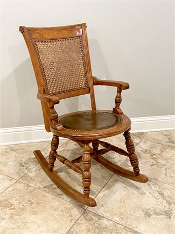 Vtg. Carved Wood Cane Back Leather Seat Rocking Chair