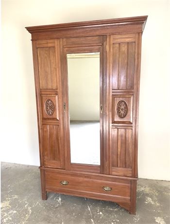 Antique Solid Wood Armoire with Hand Carved Medallions and Cherub Face Hardware